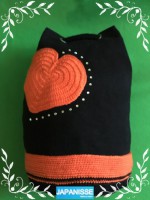 Mochila combinación tela y crochet en colores negro y naranja