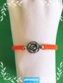 /products/pulsera-ajustable-macrame-naranja-con-rosa/